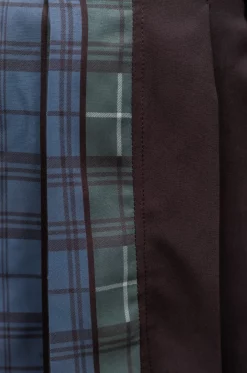 Falda de tablas, tiene combinación de rolex negro y rolex sublimado con estampado de cuadros exclusivo de nuestra marca, con pretina decorada con aros plateados