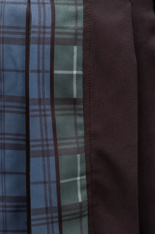 Falda de tablas, tiene combinación de rolex negro y rolex sublimado con estampado de cuadros exclusivo de nuestra marca, con pretina decorada con aros plateados